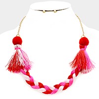 Braided thread necklace with pom pom tassels